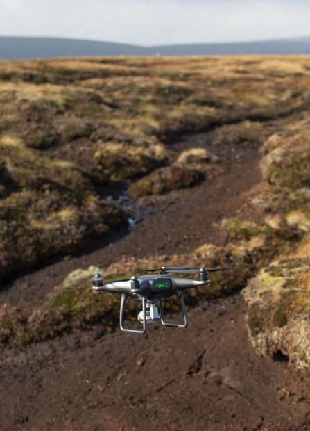 Quadcopter unmanned aerial vehicle surveying bare peat